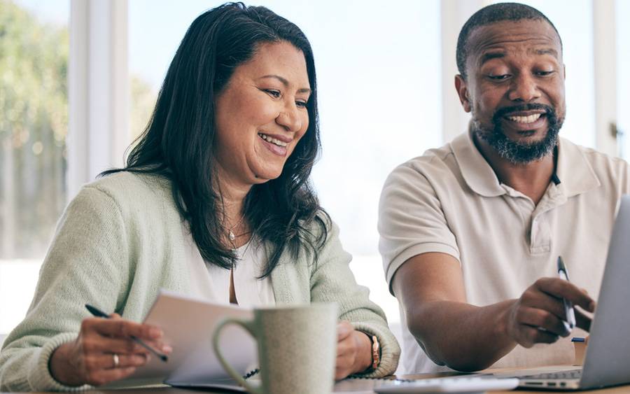 A couple looking for health insurance options during open enrollment.