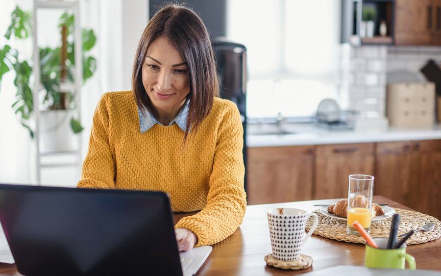 A woman reviews her health insurance options during open enrollment.