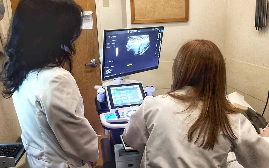 Two female doctors view medical imaging, representing new strides being made by Scripps gastroenterologists for IBD care.