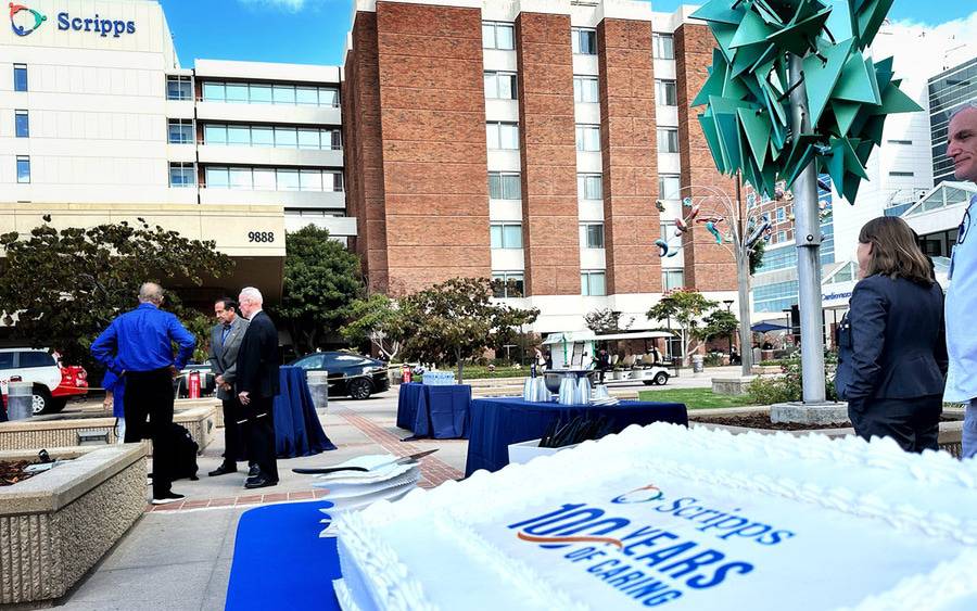 A cake displays Scripps 100 Years of Caring outside of Scripps Memorial Hospital La Jolla. 