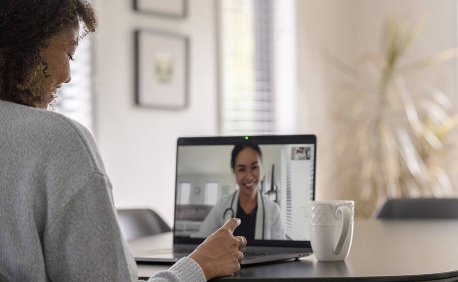 Woman on a telemedicine visit with a doctor.