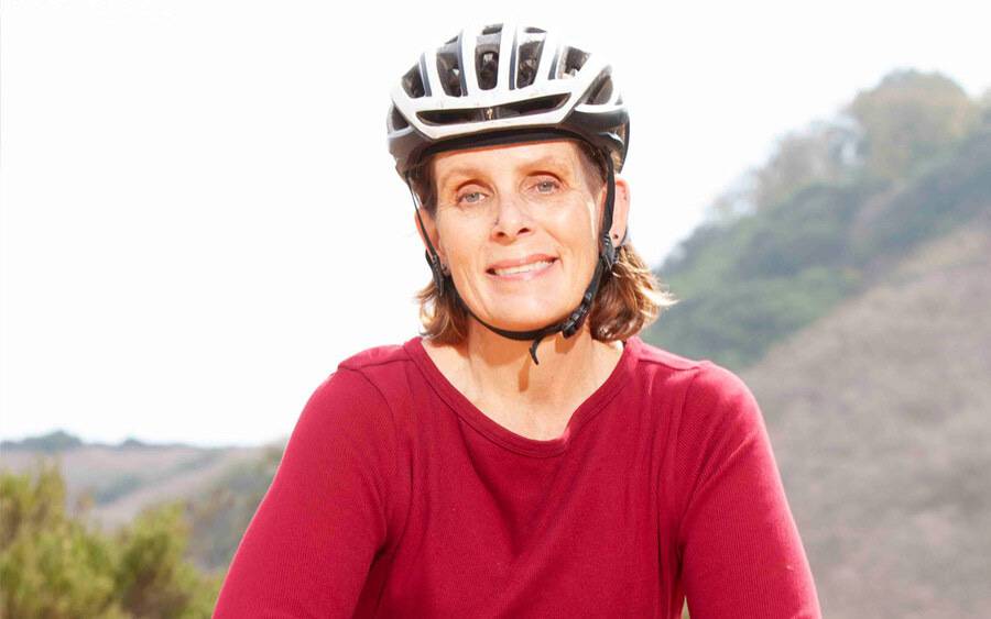 Whitney DeSpain, 52, gets back on her mountain bike after receiving a leadless pacemaker at Scripps.