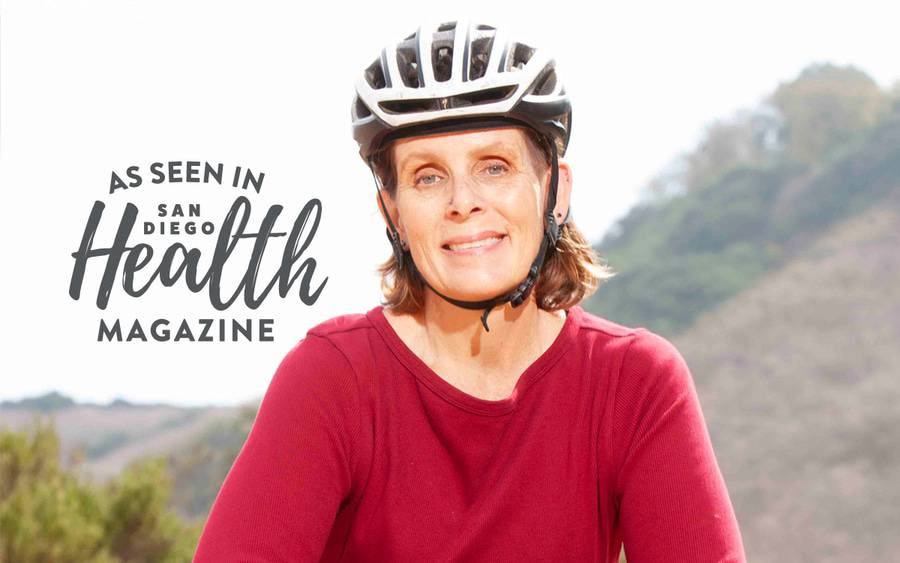 Whitney DeSpain, 52, gets back on her mountain bike after receiving a leadless pacemaker at Scripps. San Diego Health Magazine