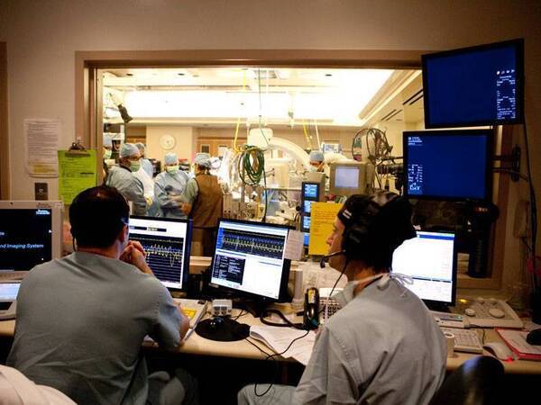 Paul Teirstein, MD and Scripps team members get ready to perform a cardiac catheterization.