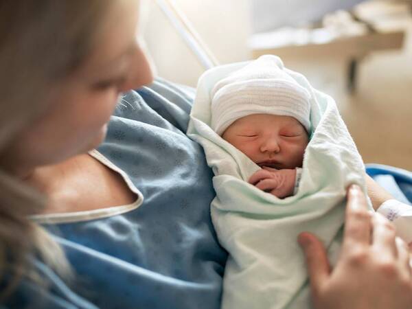 A mom and her baby after delivery; cord blood banking an option.