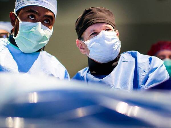 Scripps cardiovascular providers  check the monitors in surgery. SD Health Magazine.