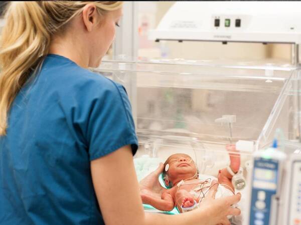 A Scripps NICU nurse cares for a baby in the neonatal care unit (NICU).