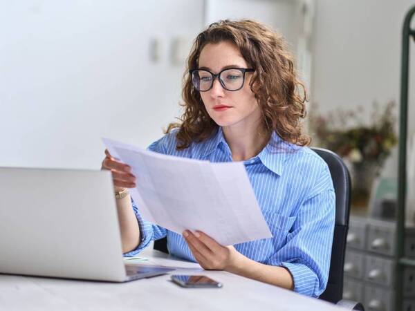 A young woman, older than 26, reviews her options for health insurance.