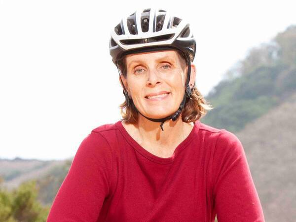 Whitney DeSpain, 52, gets back on her mountain bike after receiving a leadless pacemaker at Scripps.