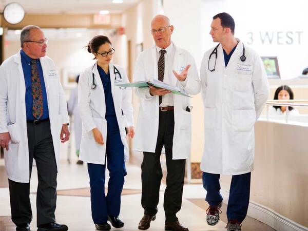 A group of Scripps LVAD physicians discuss patient care after receiving a referral. 